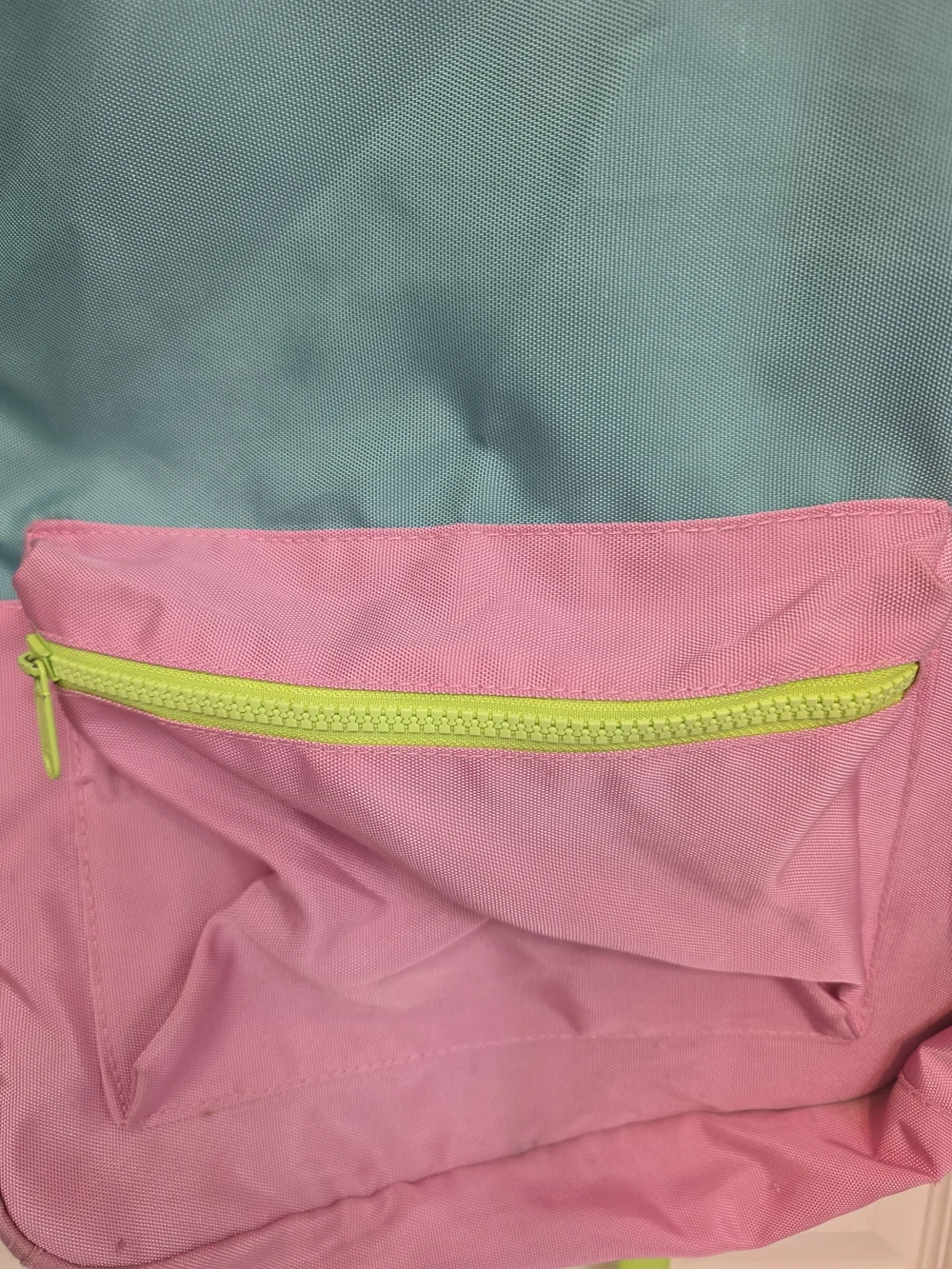 Pottery Barn Kids Astor Backpack featuring pink, aqua, and lime green colors.